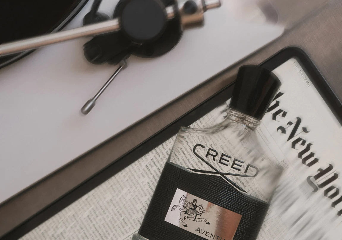 Aventus Bottle featuring newspaper background